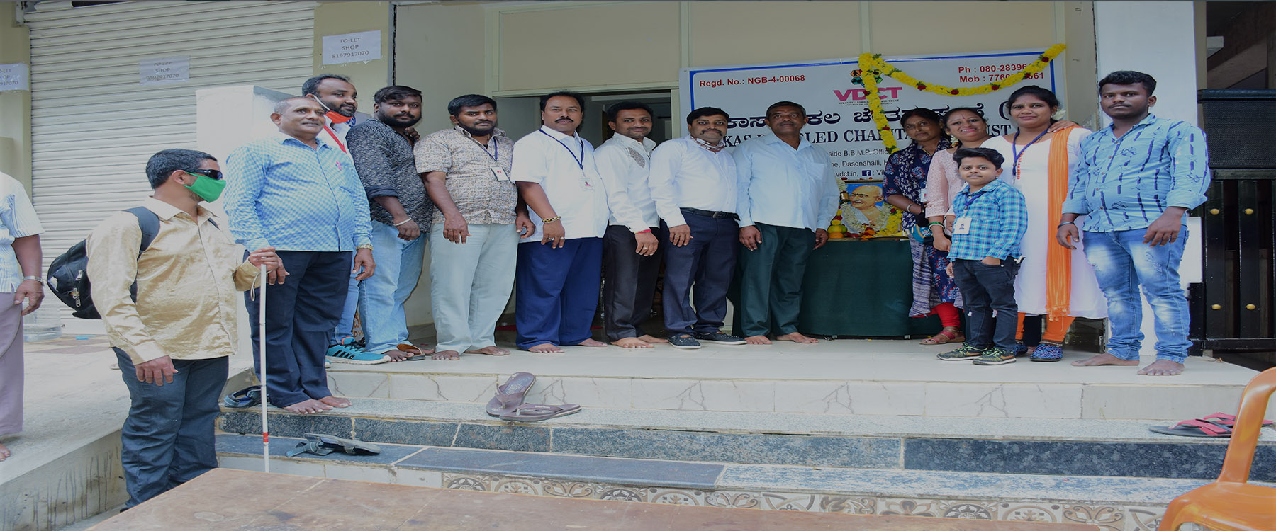 Trust members and beneficiaries gathered outside the Vikas Disabled Charitable Trust office