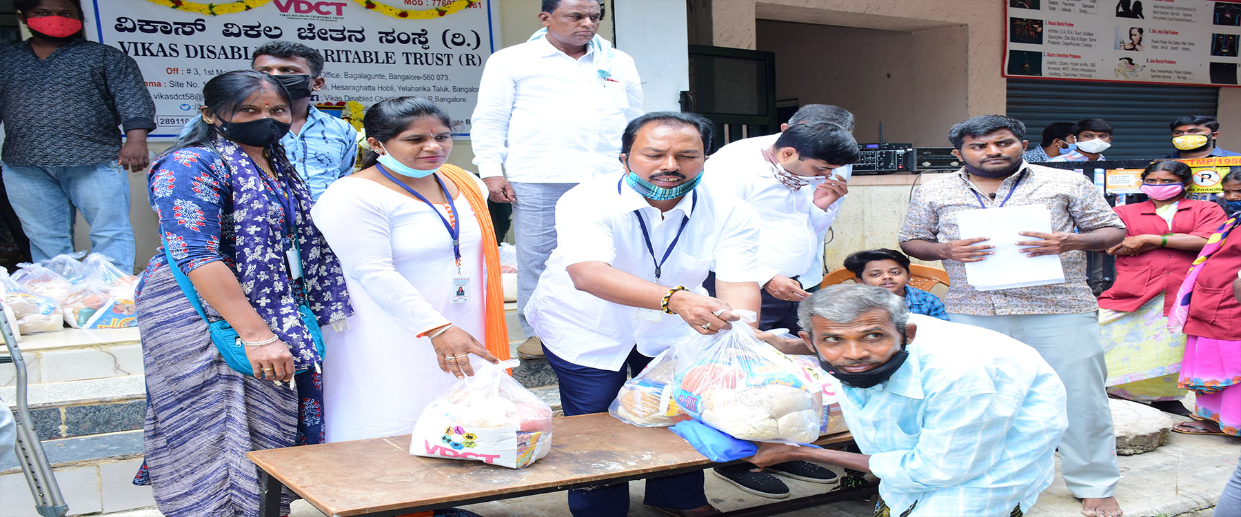 Volunteers distributing grocery kits to beneficiaries at a trust relief drive